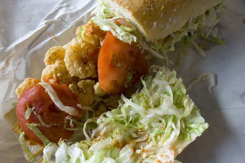 Fried shrimp po-boy with lettuce and tomato on French bread